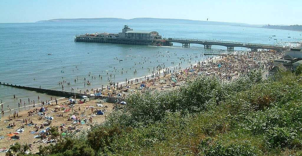 The beach near Bournemouth Pier; Dorset's coastline is a major attraction for tourists