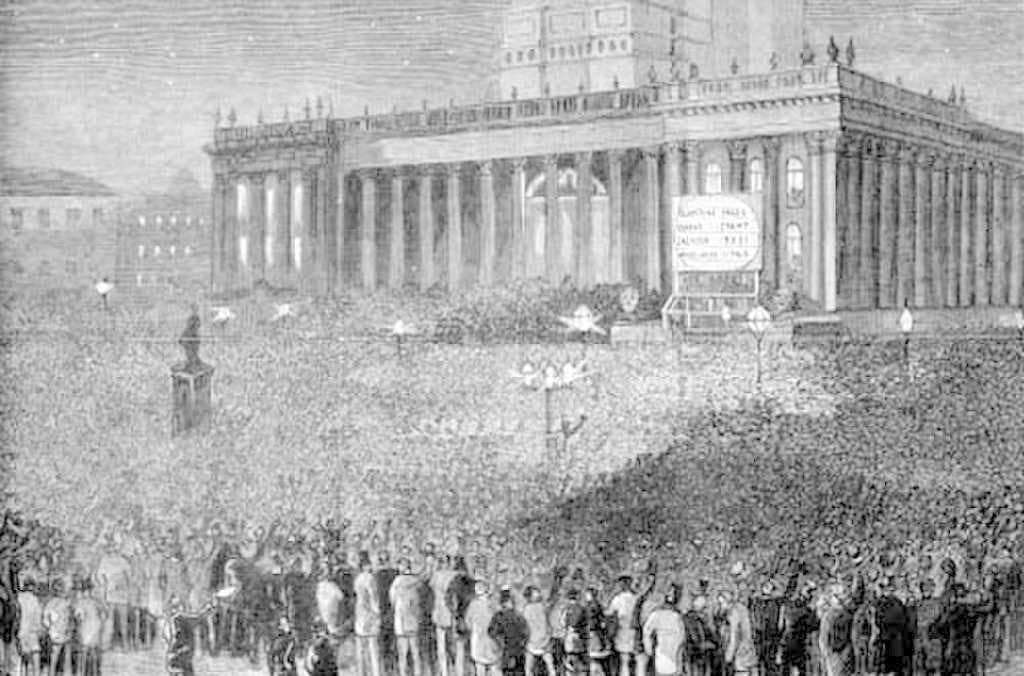 A crowd gathers outside Leeds Town Hall during the 1880 general elections.
