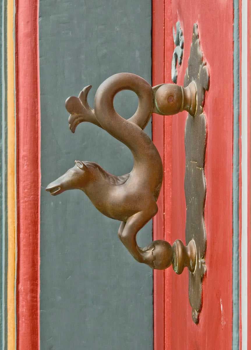 Door knocker with the name "Brunswick Horse" at the front door of a half-timbered house dating from the year 1719 in the town centre of Goslar.