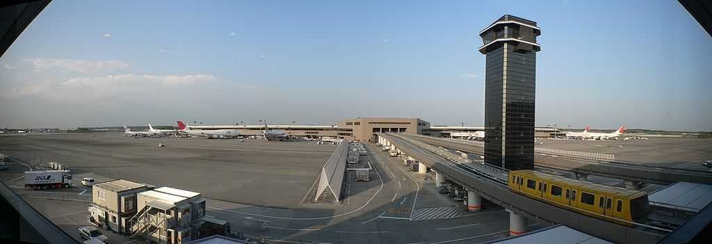 Panorama from inside the Yahoo! Internet Cafe showing the Terminal 2 satellite, ramp control tower and airport shuttle (removed in 2013)