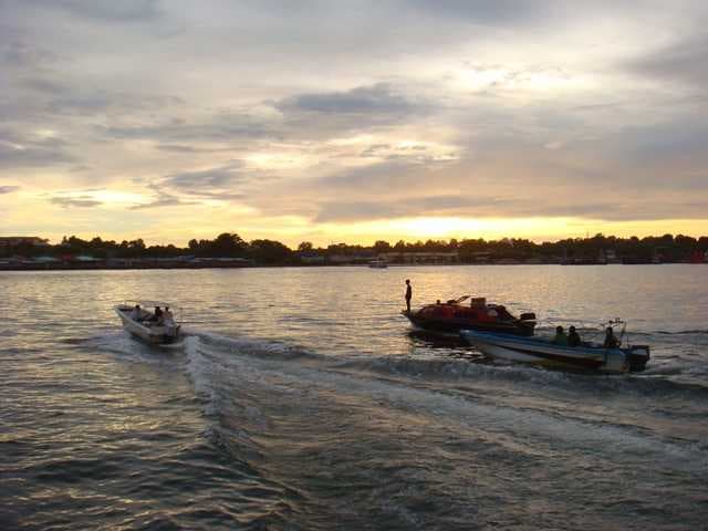 Boats heading for the water village in Labuan