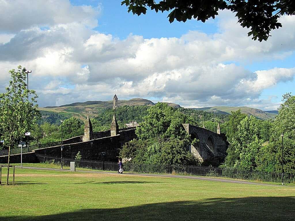Stirling Bridge with the Wallace Monument and Abbey Craig in the background, one of a series of local Crag and Tail hills.