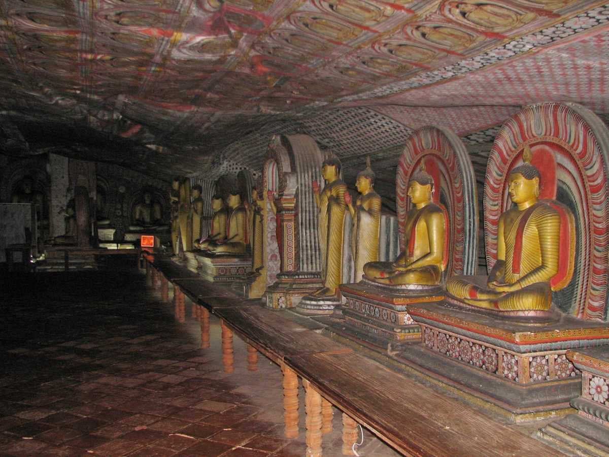 A series of identically carved Buddhas inside one of the cave temples of Dambulla