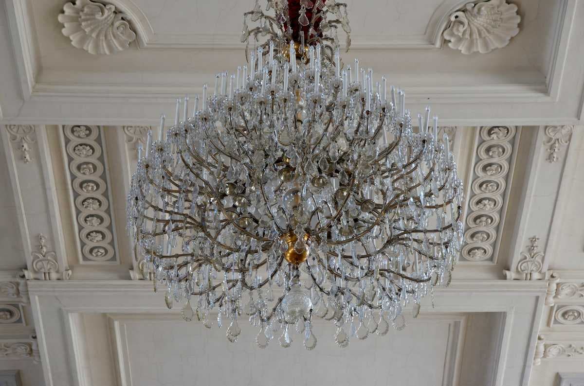 A chandelier inside the riding school.
