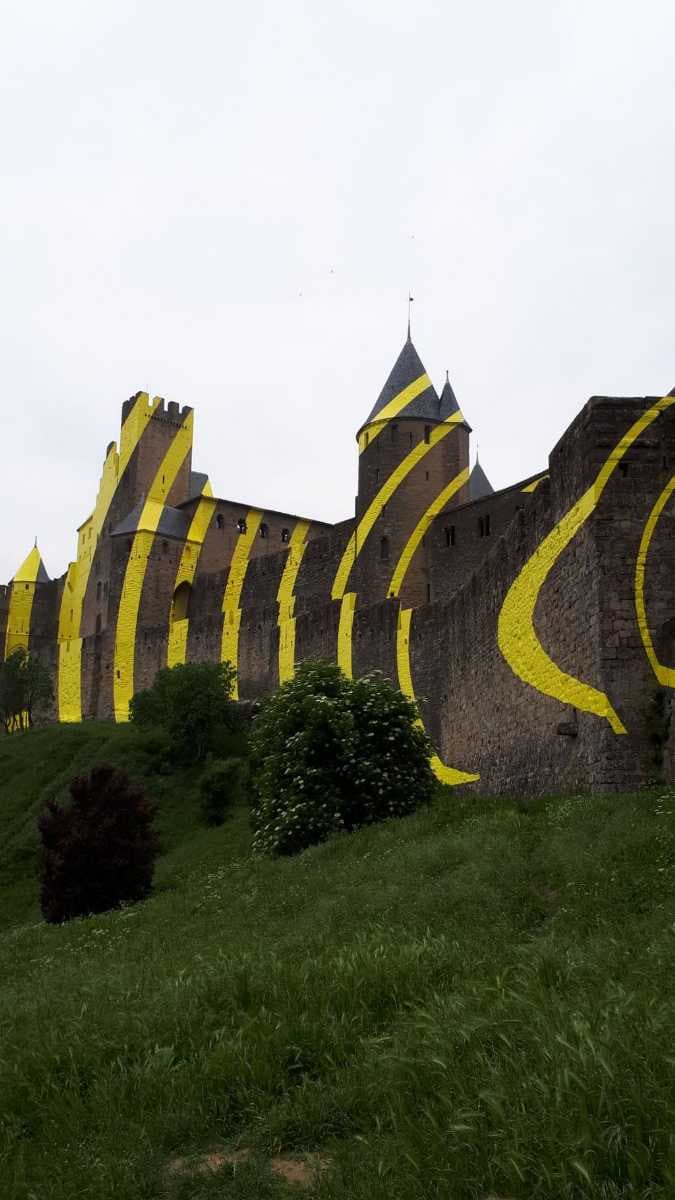 Felice Varini, project "Concentric, eccentric" with concentric yellow circles, at Carcassonne for the 7th "IN SITU, Heritage and contemporary art" event in May 2018 to celebrate the 20th anniversary of the inscription on the World Heritage List of UNESCO