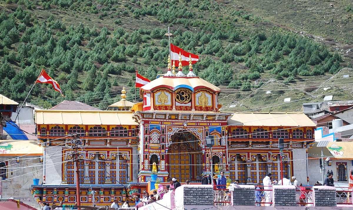 Ancient temple of Badrinath with mighty Himalayas in the background