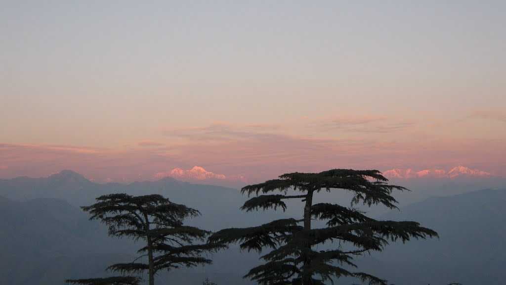 Sunset reflection on snowy peaks Chakrata