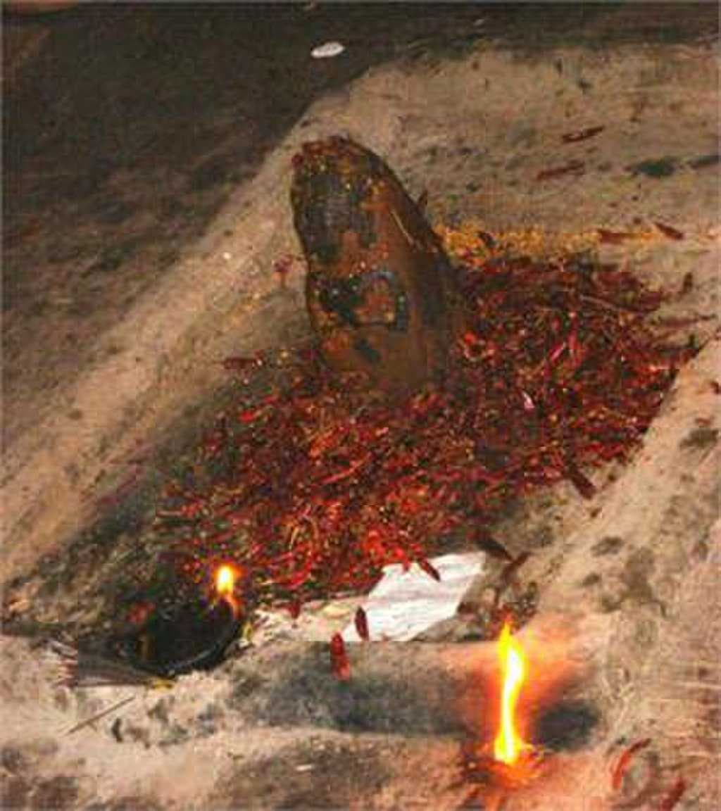 Main offering, red chilly grinding in Masani Amman