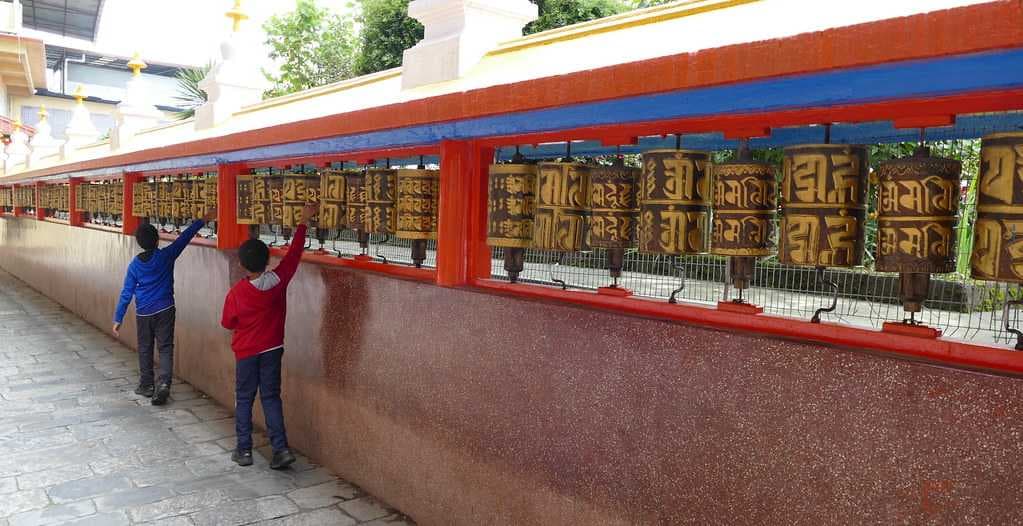 108 Mani Lhakor or prayer wheels around Do Drul Chorten Stupa