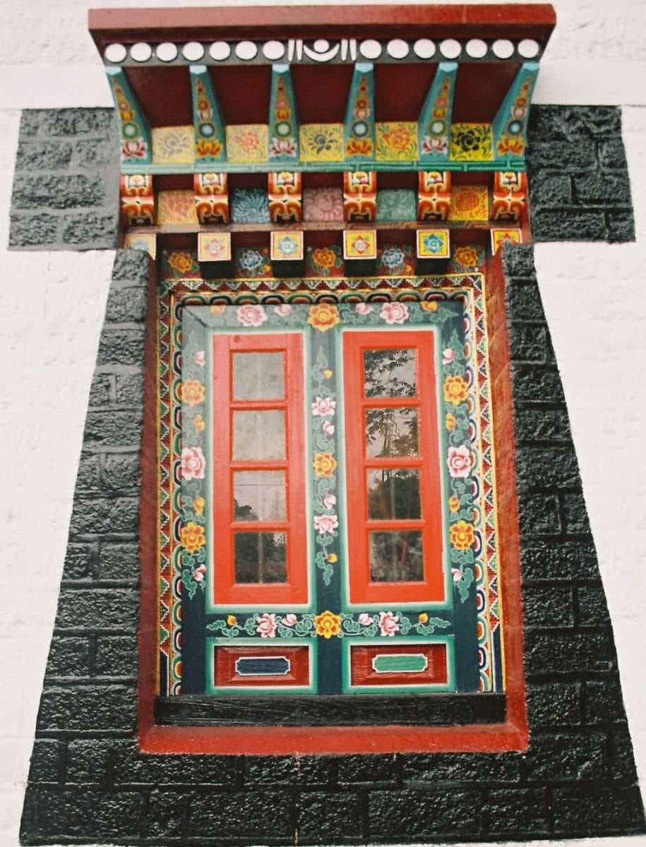 Ornately carved colourful Window of prayer hall