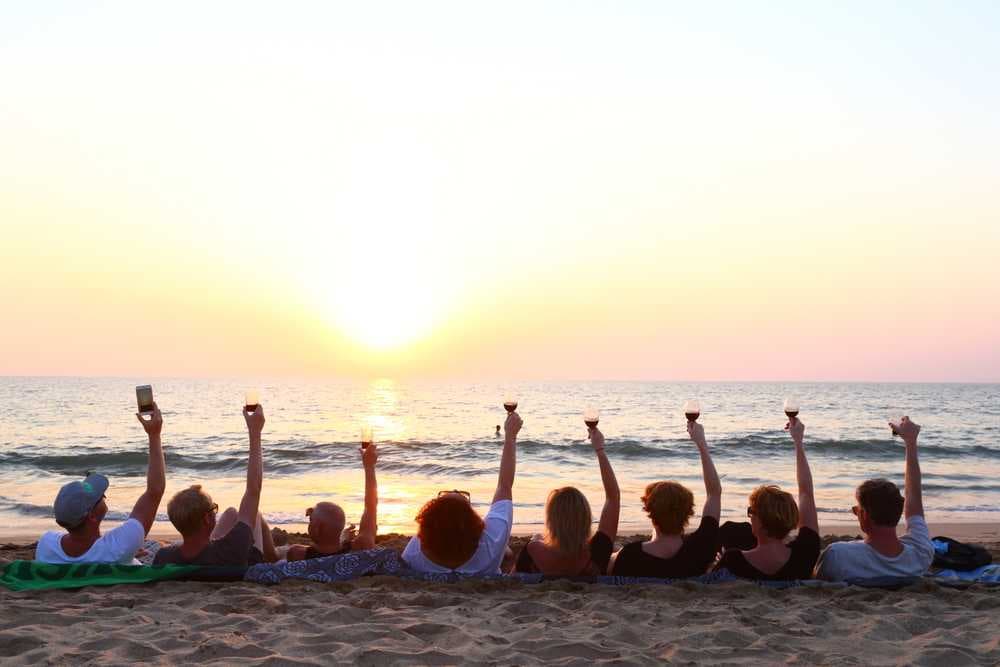 Group of Friends Enjoying Sunset at Palolem Beach, Goa