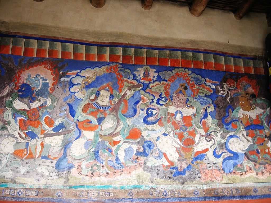 A renovated mural depicting the Four Heavenly Kings opposite a prayer hall (2009). The same mural is seen in a ruined stage in the 2004 photo (below, in Structures) at the top of the stairs.