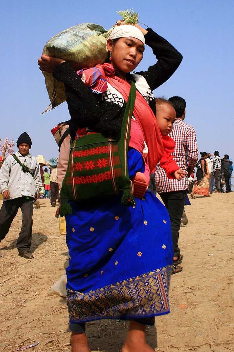 An indigenous Assamese lady with her child at Joonbeel Fair