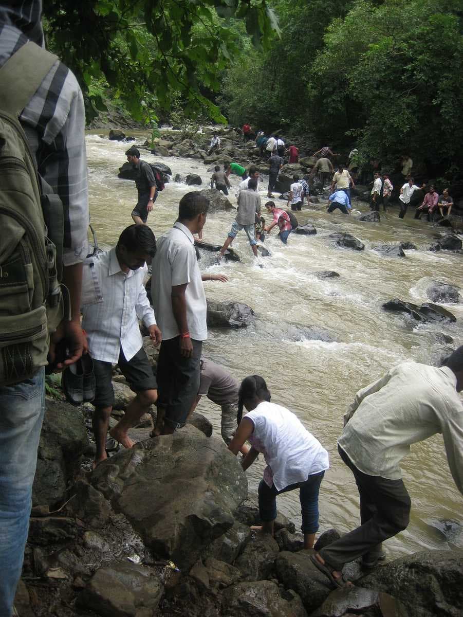 People visiting Dugarwadi waterfall in rainy season