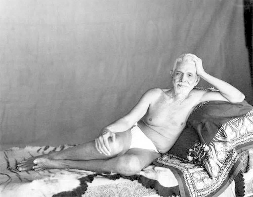 Sri Ramana Maharshi reclining in the Old Hall where he lived from 1927 to 1950