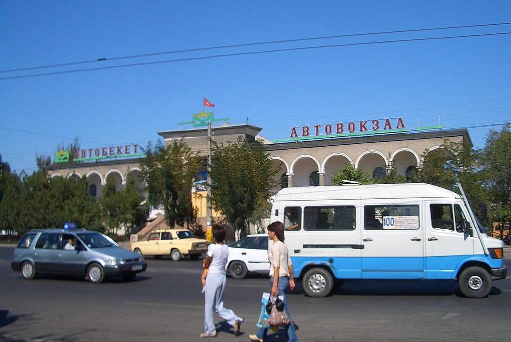 A typical Bishkek passenger van passes by the East Bus Terminal.