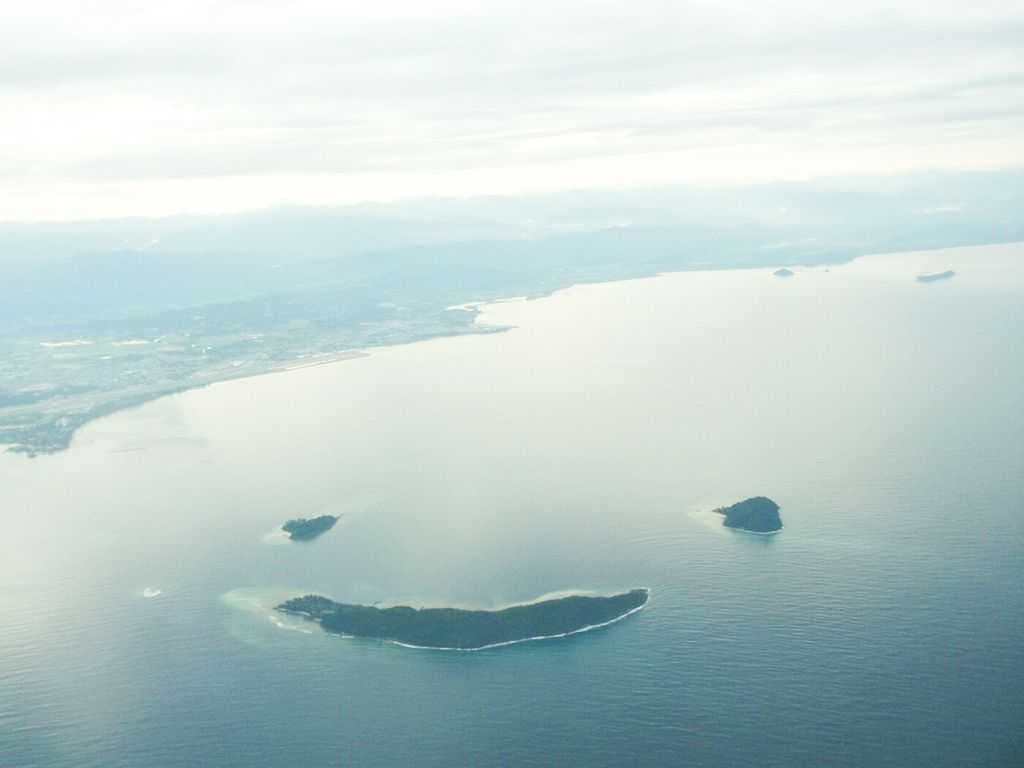 An aerial view of Mamutik (top left), Sulug (top right) and Manukan (bottom) resembles a smiling face.