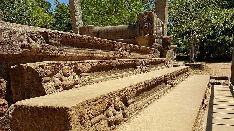 Sculptures of Buddha on steps in the ancient city of Anuradhapura, Sri Lanka
