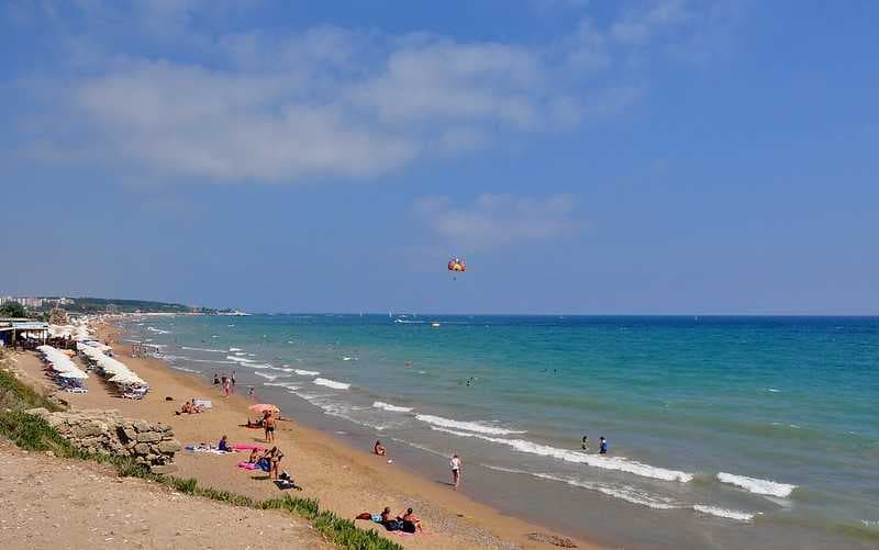 Tourists enjoying a sunny day at Side's East Beach